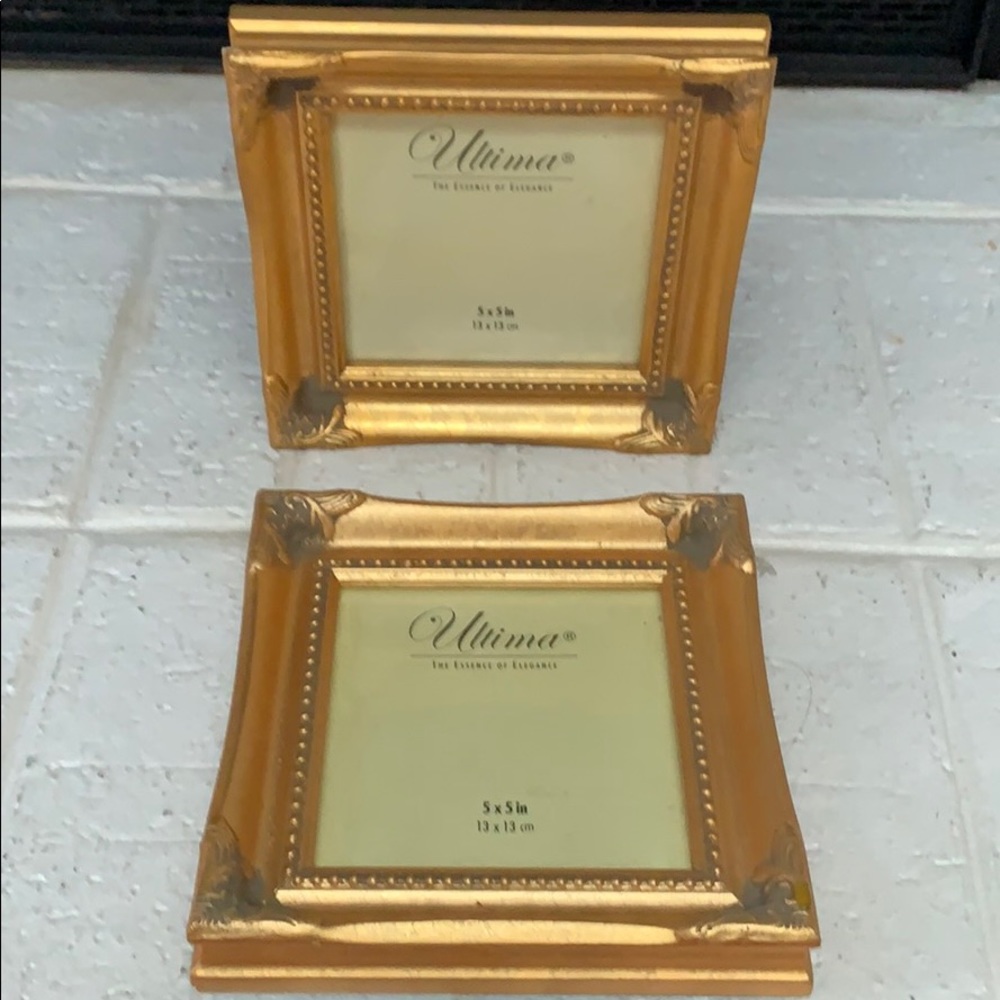 A set of 5x5 gold picture frames